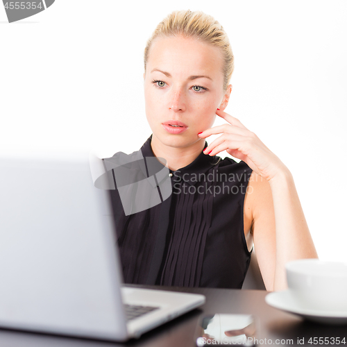 Image of Business woman in office.