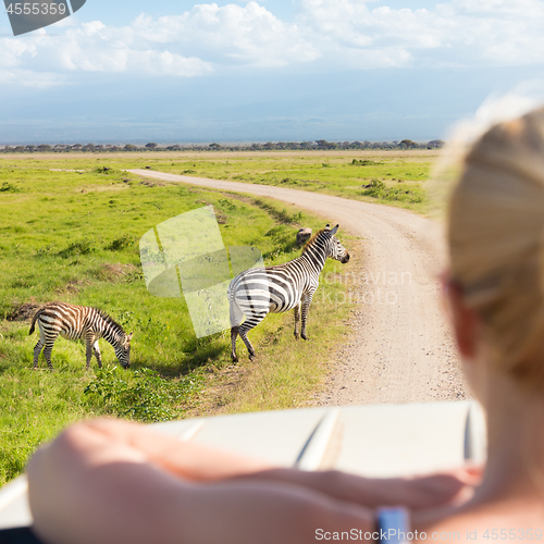 Image of Woman on african wildlife safari.