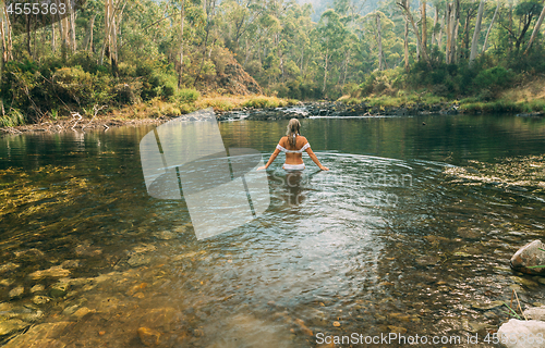 Image of Woman wading in thermal springs in Australia