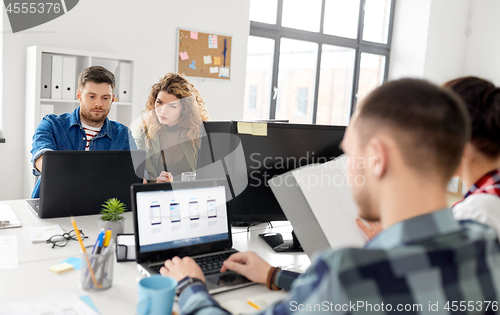 Image of creative team working on user interface at office