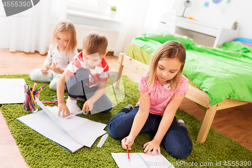 Image of children drawing and making crafts at home