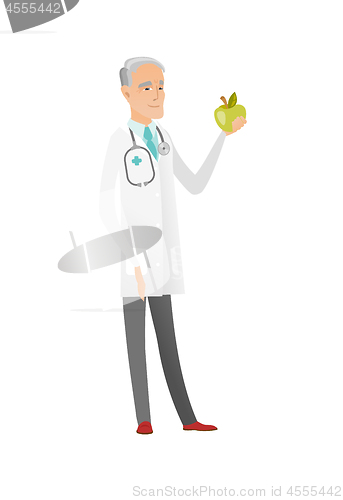 Image of Caucasian nutritionist offering fresh red apple.