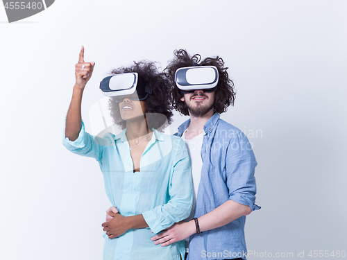 Image of multiethnic couple getting experience using VR headset glasses