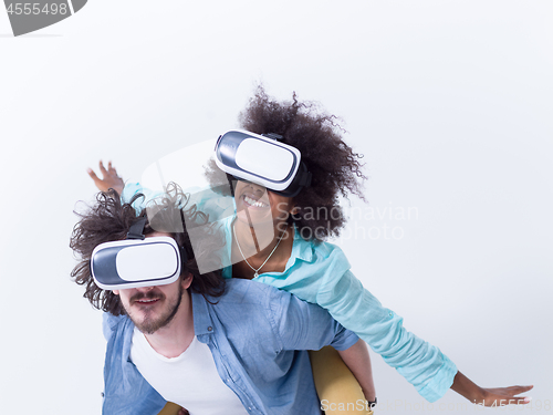 Image of multiethnic couple getting experience using VR headset glasses