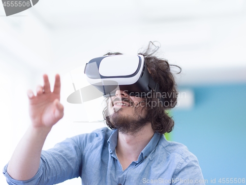 Image of man using VR-headset glasses of virtual reality