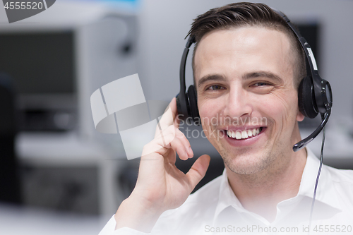 Image of male call centre operator doing his job