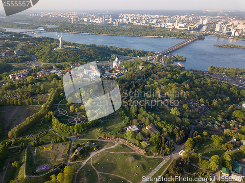 Image of A bird\'s eye view, panoramic view from the drone to the Botanical Garden, the Motherland Monument , Dnieper River, Paton Bridge in the city of Kiev, Ukraine