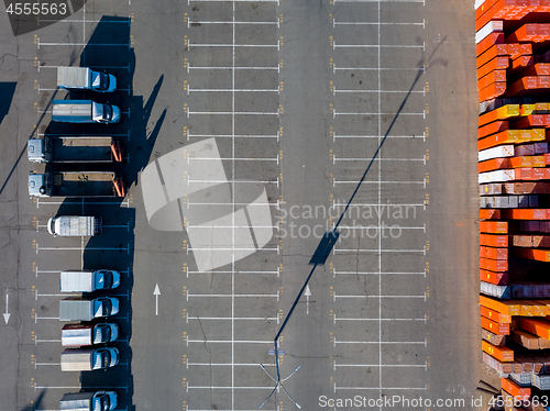 Image of Ukraine, Kiev. April 08, 2018. Building store Epicentr K. Parking place, warehouse storage of building materials and trucks, ready for loading with building materials.