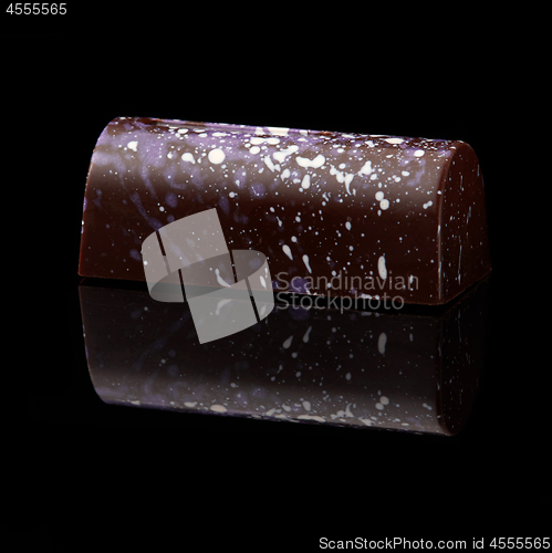 Image of chocolate candy on black background