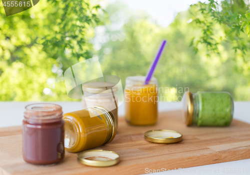 Image of vegetable or fruit puree or baby food in jars