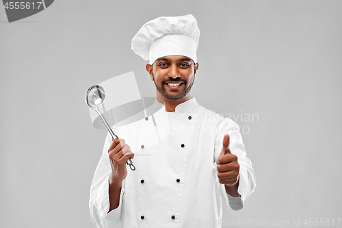 Image of happy indian chef with ladle showing thumbs up