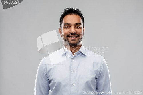 Image of indian businessman in shirt over grey background
