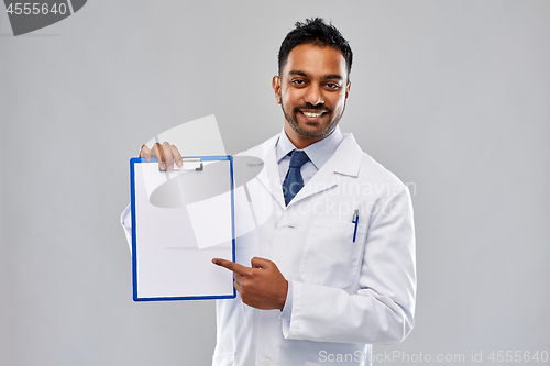 Image of doctor or scientist with white paper on clipboard