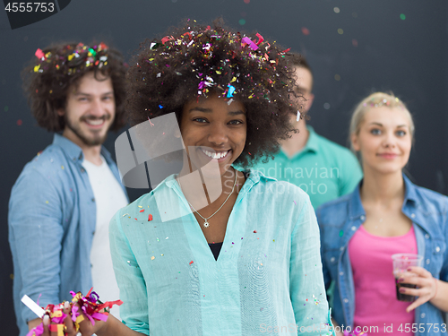 Image of confetti party multiethnic group of people isolated over gray