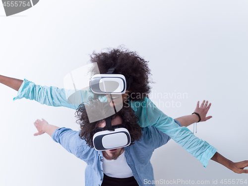 Image of multiethnic couple getting experience using VR headset glasses