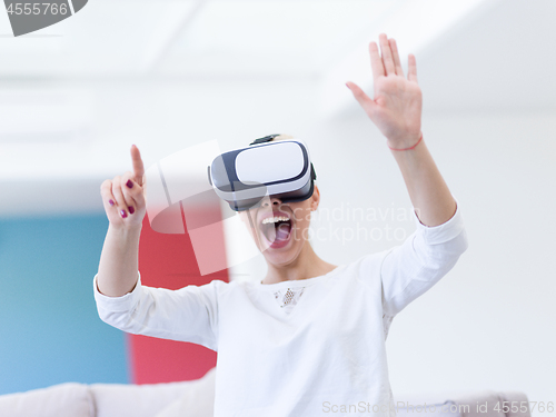 Image of woman using VR-headset glasses of virtual reality
