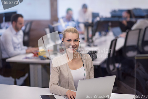 Image of businesswoman using a laptop in startup office