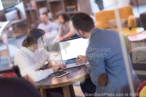 Image of Business team Working With laptop in creative office