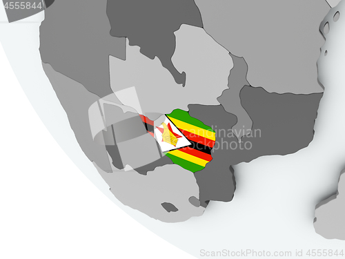 Image of Flag of Zimbabwe on political globe