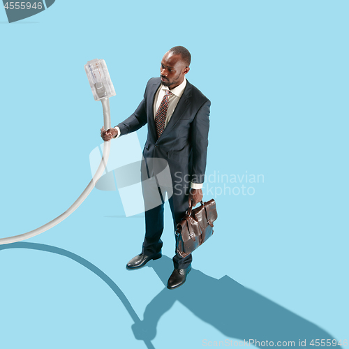 Image of Man holding USB cable in hand