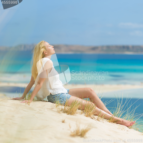 Image of Relaxed Happy Woman Enjoying Sun on Vacations.