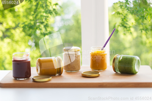 Image of vegetable or fruit puree or baby food in jars