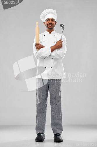 Image of happy indian chef with ladle and rolling-pin