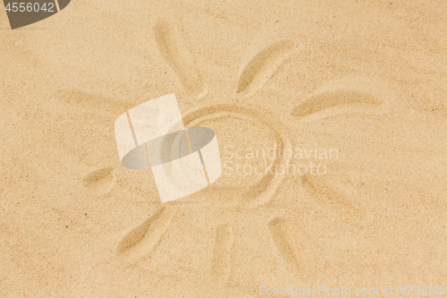 Image of picture of sun in sand on summer beach