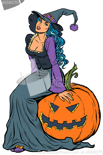Image of Halloween witch sitting on a pumpkin
