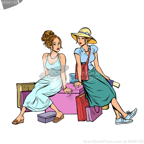 Image of Two female friends sitting on the shopping