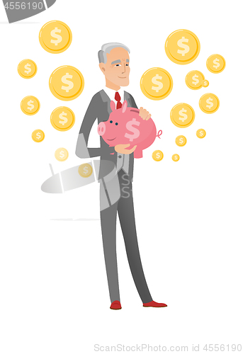 Image of Senior caucasian businessman holding a piggy bank.