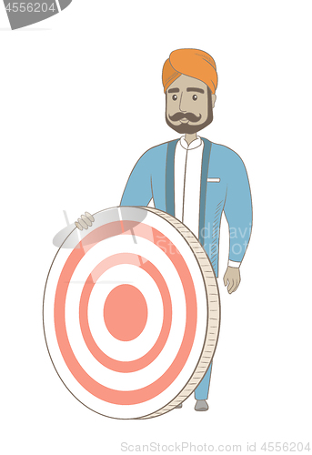 Image of Young hindu businessman and dart board.