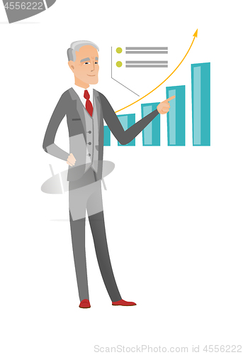 Image of Senior caucasian businessman pointing at chart.