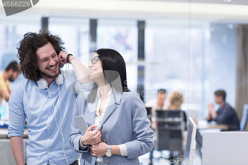 Image of Business People Working With Tablet in startup office