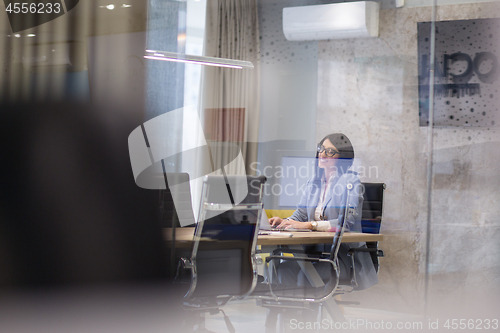 Image of businesswoman using a laptop in startup office