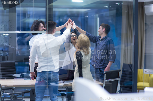 Image of startup Group of young business people celebrating success