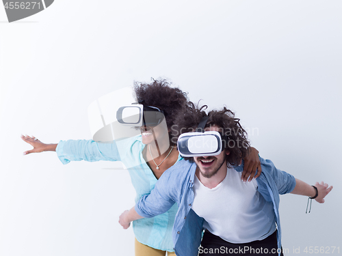 Image of multiethnic couple getting experience using VR headset glasses