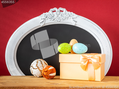 Image of Easter decoration gift box eggs and vintage frame