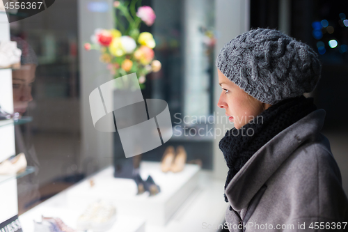 Image of Woman window shopping.