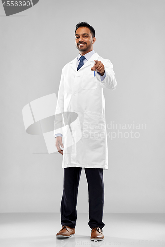 Image of smiling indian doctor or scientist pointing to you