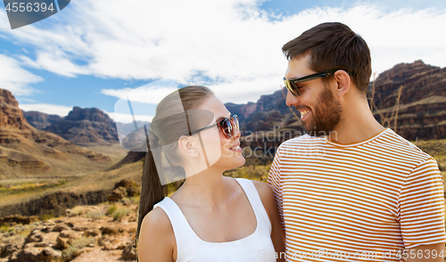 Image of couple in sunglasses in summer over grand canyon