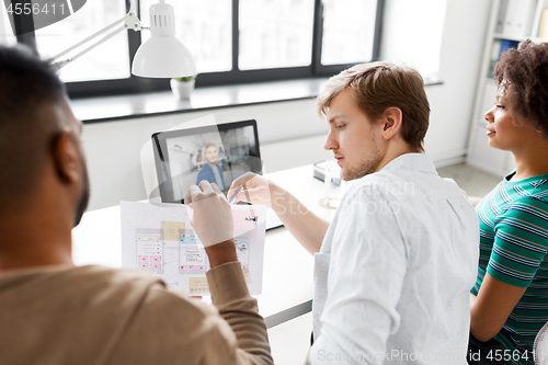 Image of creative team having video conference at office