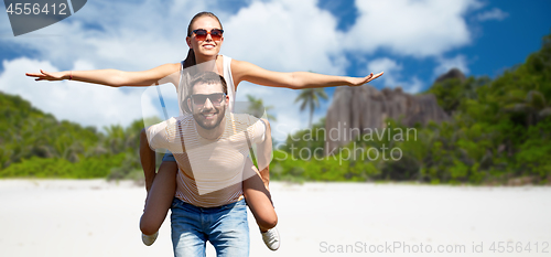 Image of happy couple having fun on seychelles island