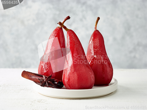 Image of Pears poached in red wine