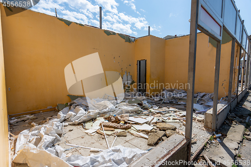 Image of Dismantling of an illegally built store, the rest of the walls, construction waste