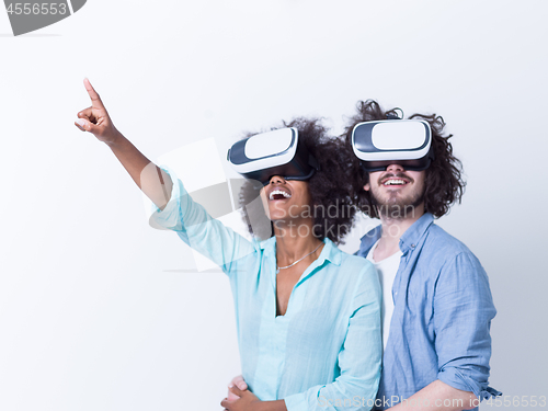 Image of multiethnic couple getting experience using VR headset glasses