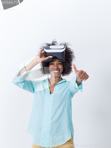 Image of black girl using VR headset glasses of virtual reality