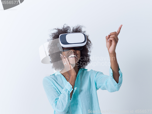 Image of black girl using VR headset glasses of virtual reality