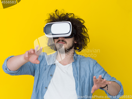 Image of handsome man using VR headset glasses of virtual reality