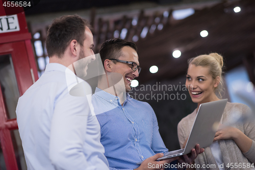 Image of Business team Working With laptop in creative office